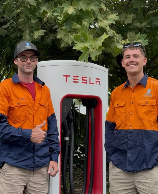 All Field Electrical team installing Tesla EV charger in Newcastle